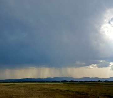 Open Idaho high-desert country under a dramatic sky near Carey and the Camas Prairie
